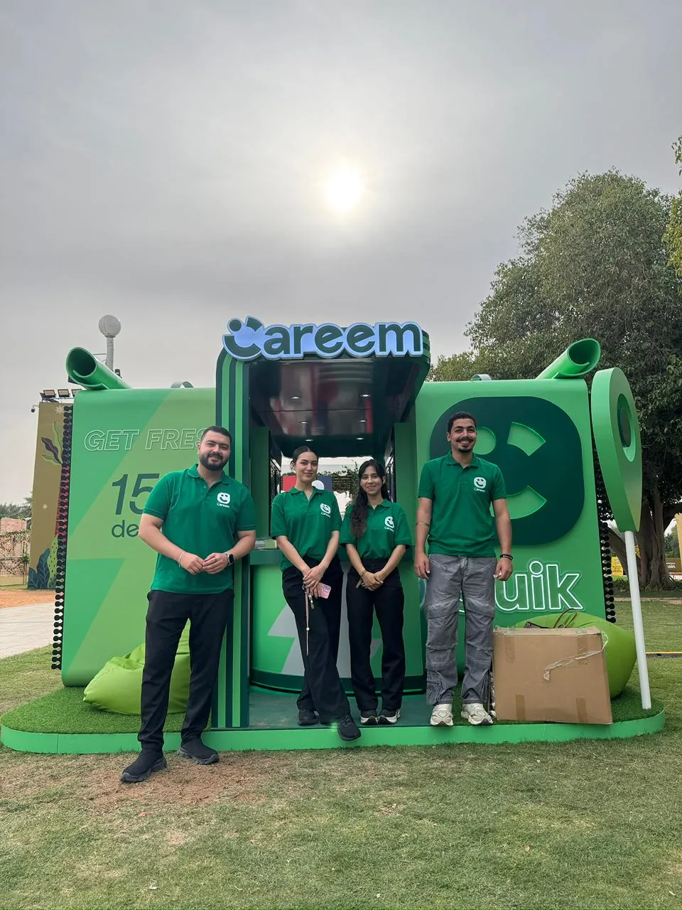 Promoters at the Careem Food and Quik booth at an outdoor event (1)