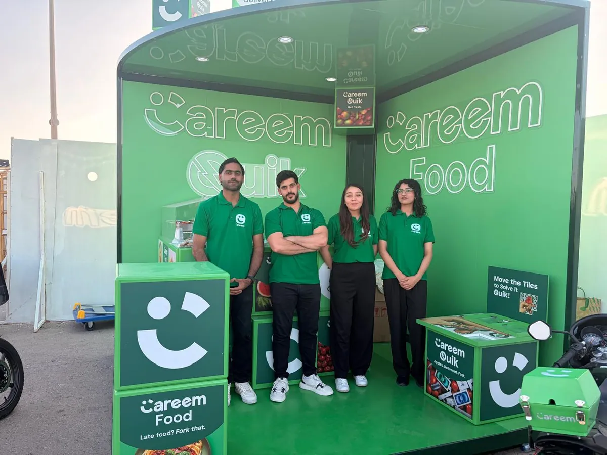 Promoters at the Careem Food and Quik booth at an outdoor event (2)