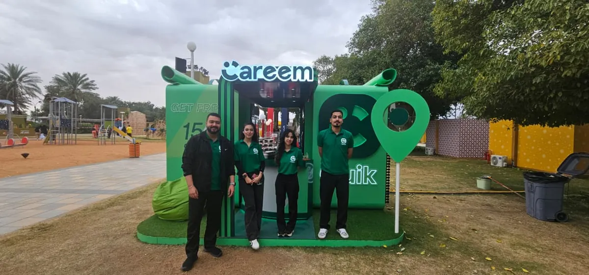 Promoters at the Careem Food and Quik booth at an outdoor event (3)