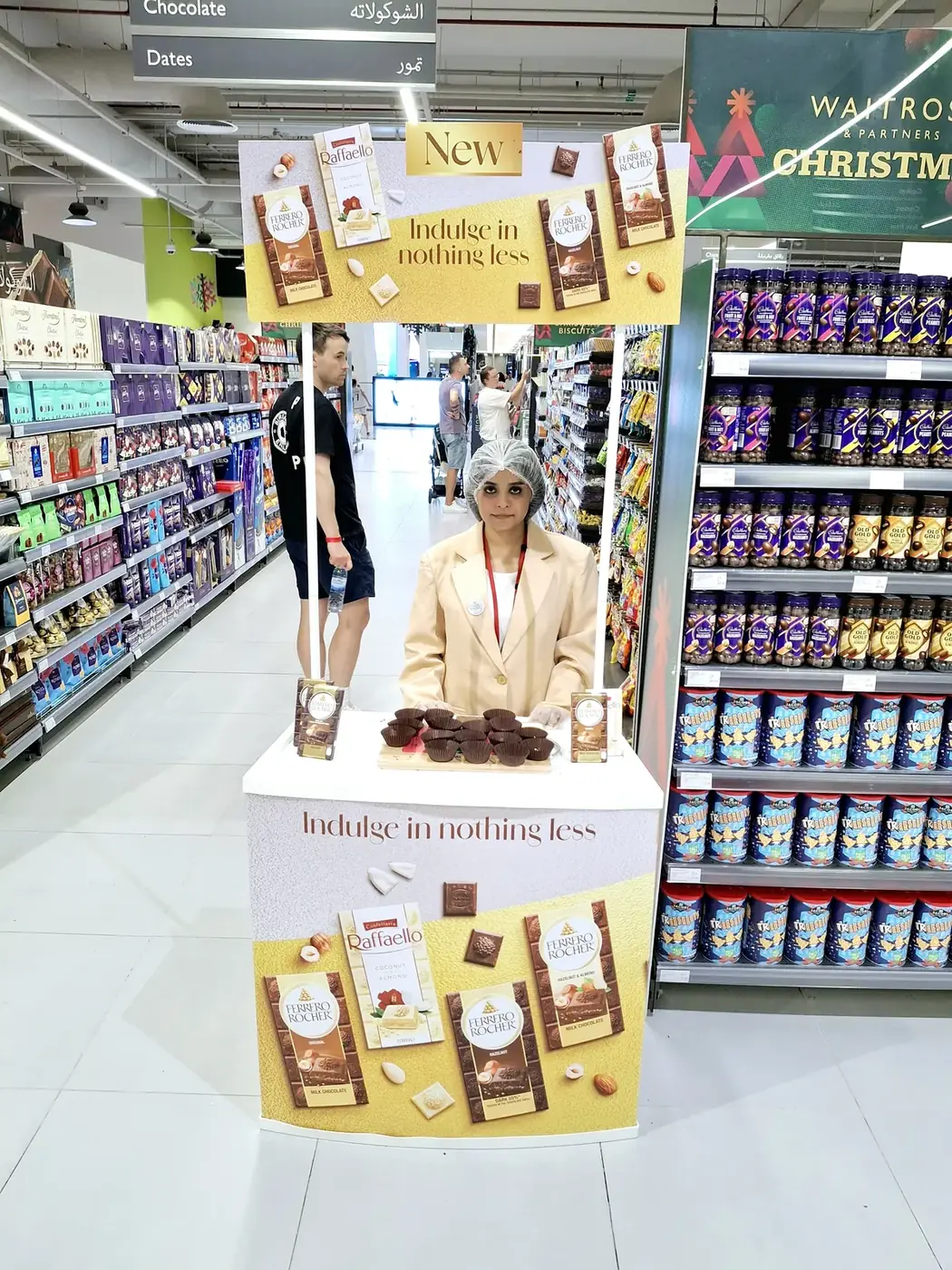Promoter at a Ferrero or Kinder confectionery stand in a UAE supermarket (1)