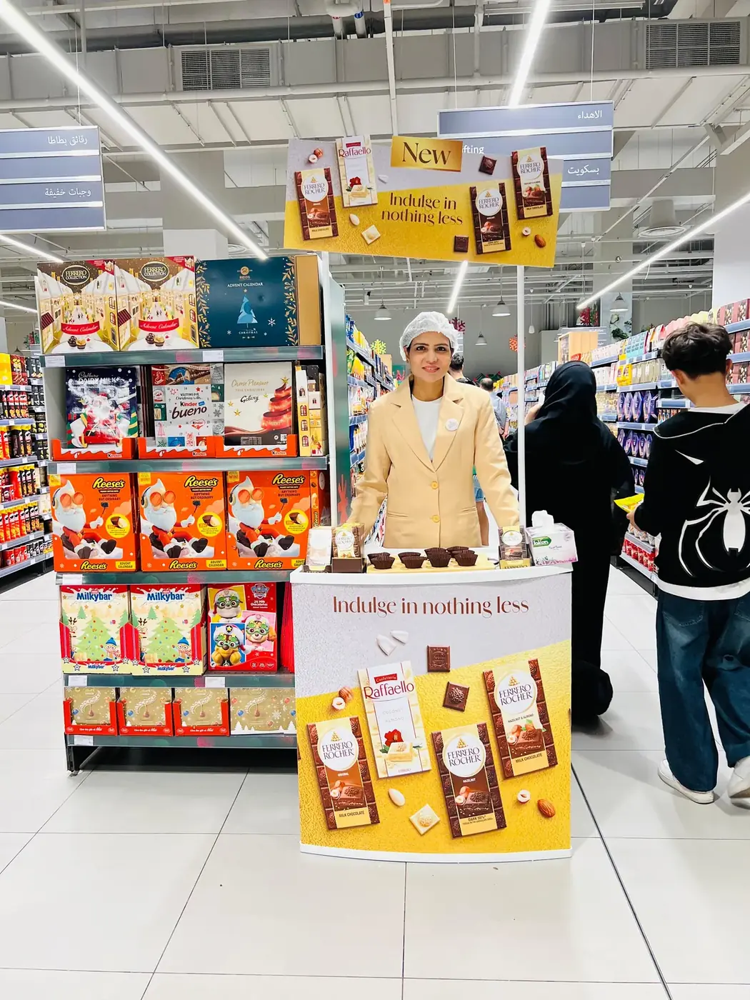 Promoter at a Ferrero or Kinder confectionery stand in a UAE supermarket (2)