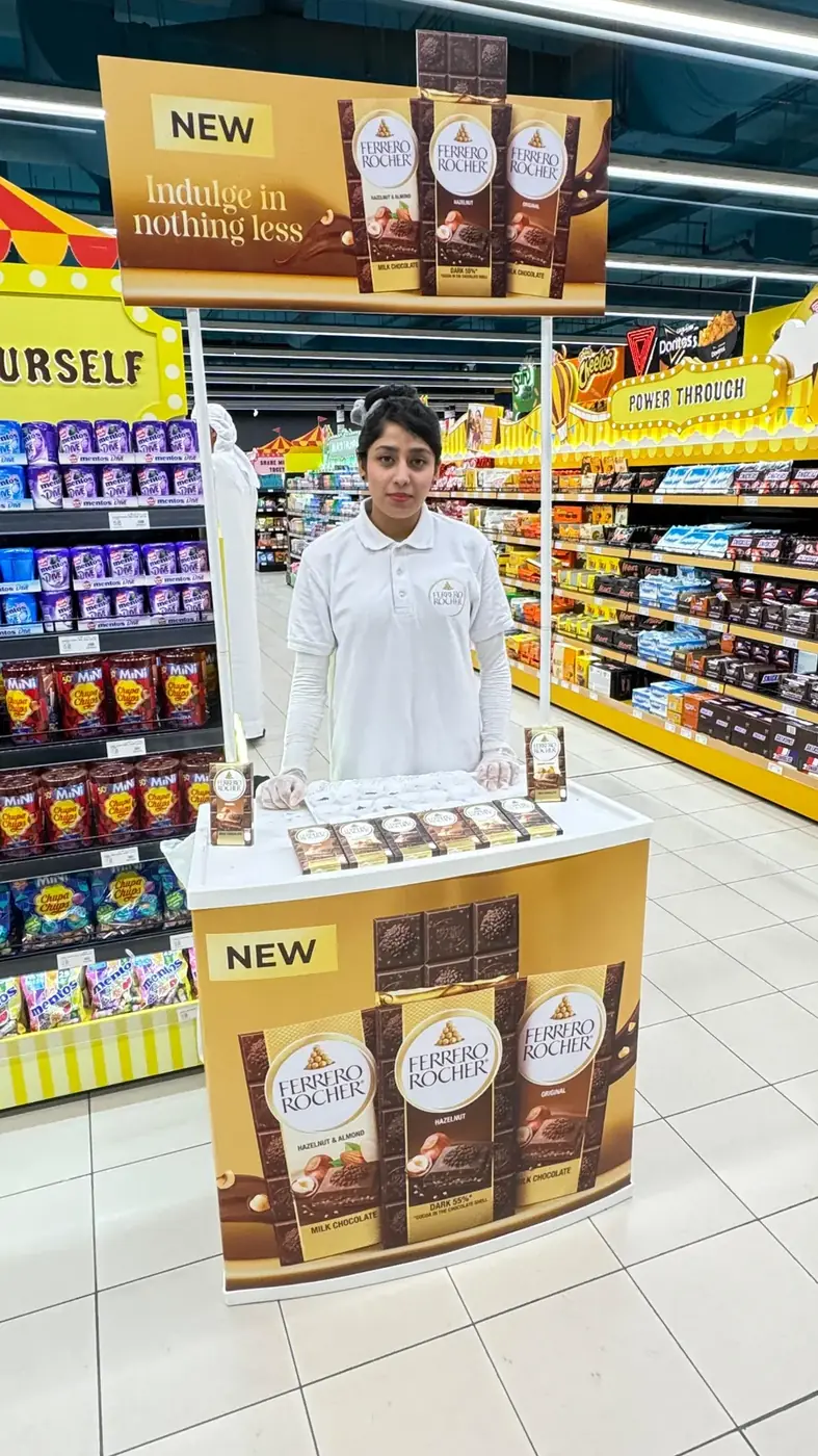 Promoter at a Ferrero or Kinder confectionery stand in a UAE supermarket (3)