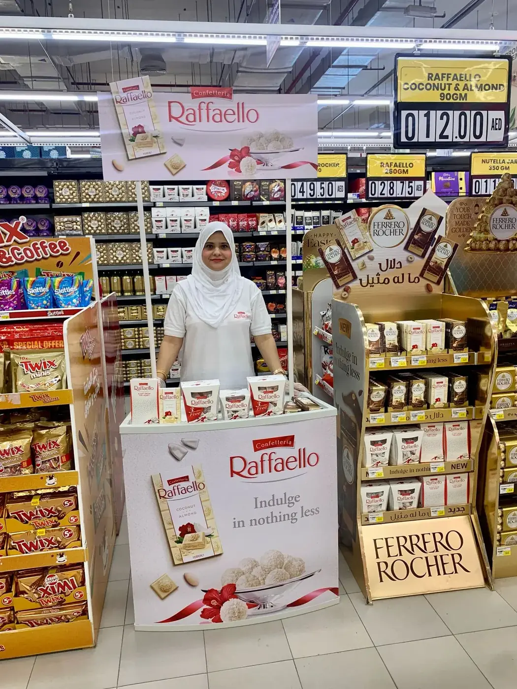 Promoter at a Ferrero or Kinder confectionery stand in a UAE supermarket (4)