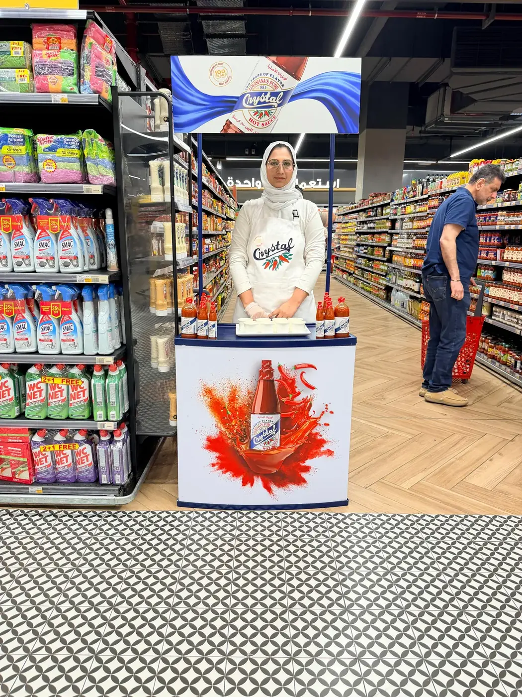 Promoter at a Crystal sauce sampling stand (2)