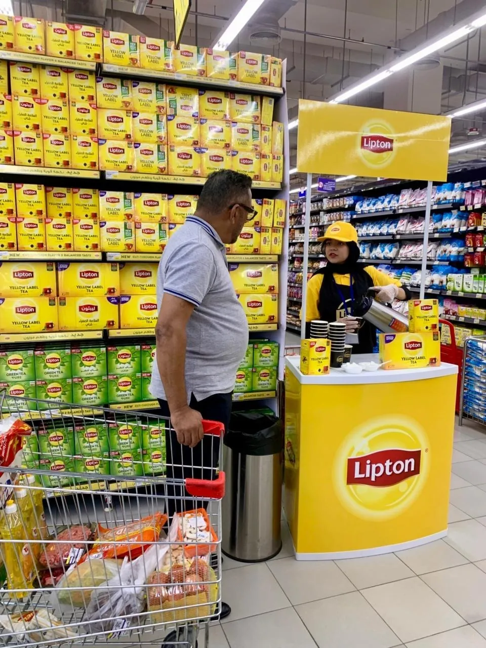 Promoter at a Lipton tasting counter (2)
