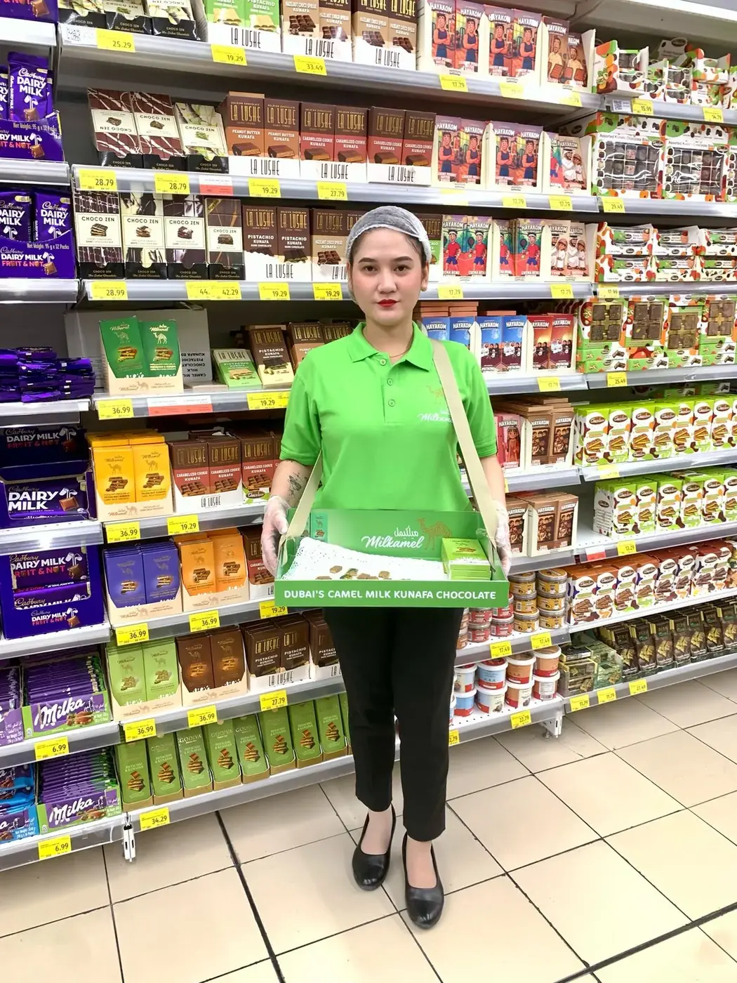 Milkamel promoter offering camel milk kunafa chocolate samples in a supermarket aisle (1)