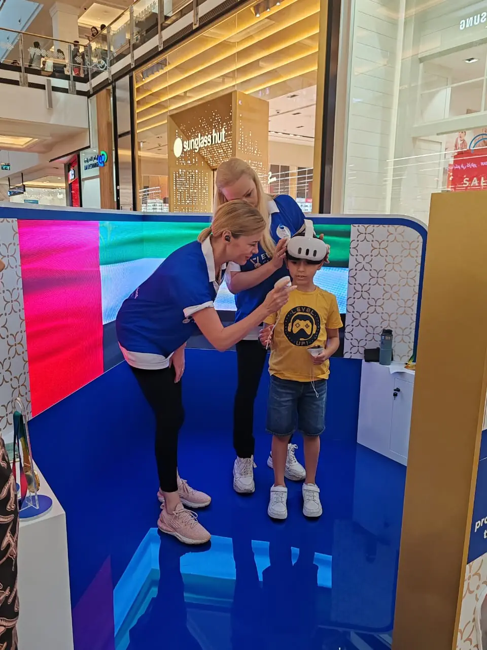 Promoters at the Olympics-themed mall kiosk (2)