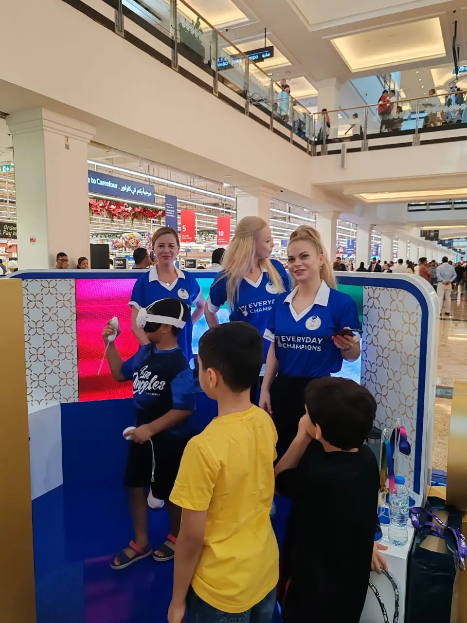 Promoters at the Olympics-themed mall kiosk (3)