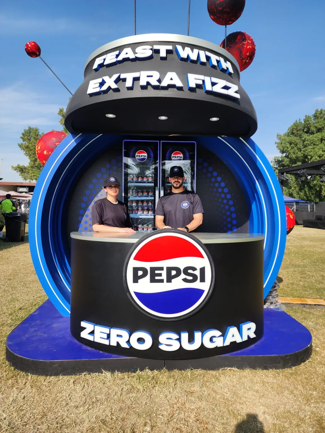 Branded staff at the Pepsi Zero Sugar stand at an outdoor event (1)