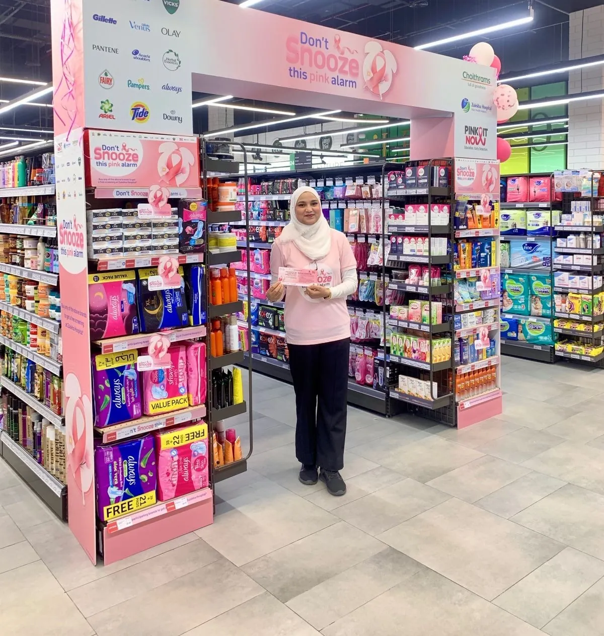 Promoter at the pink alarm awareness display in a supermarket (2)