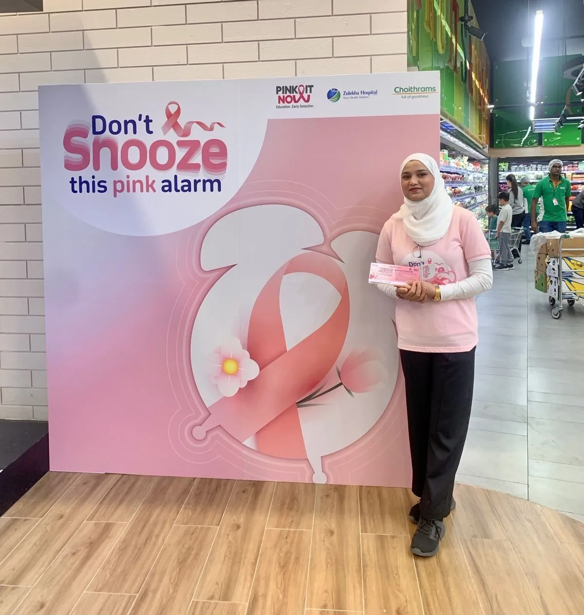 Promoter at the pink alarm awareness display in a supermarket (3)