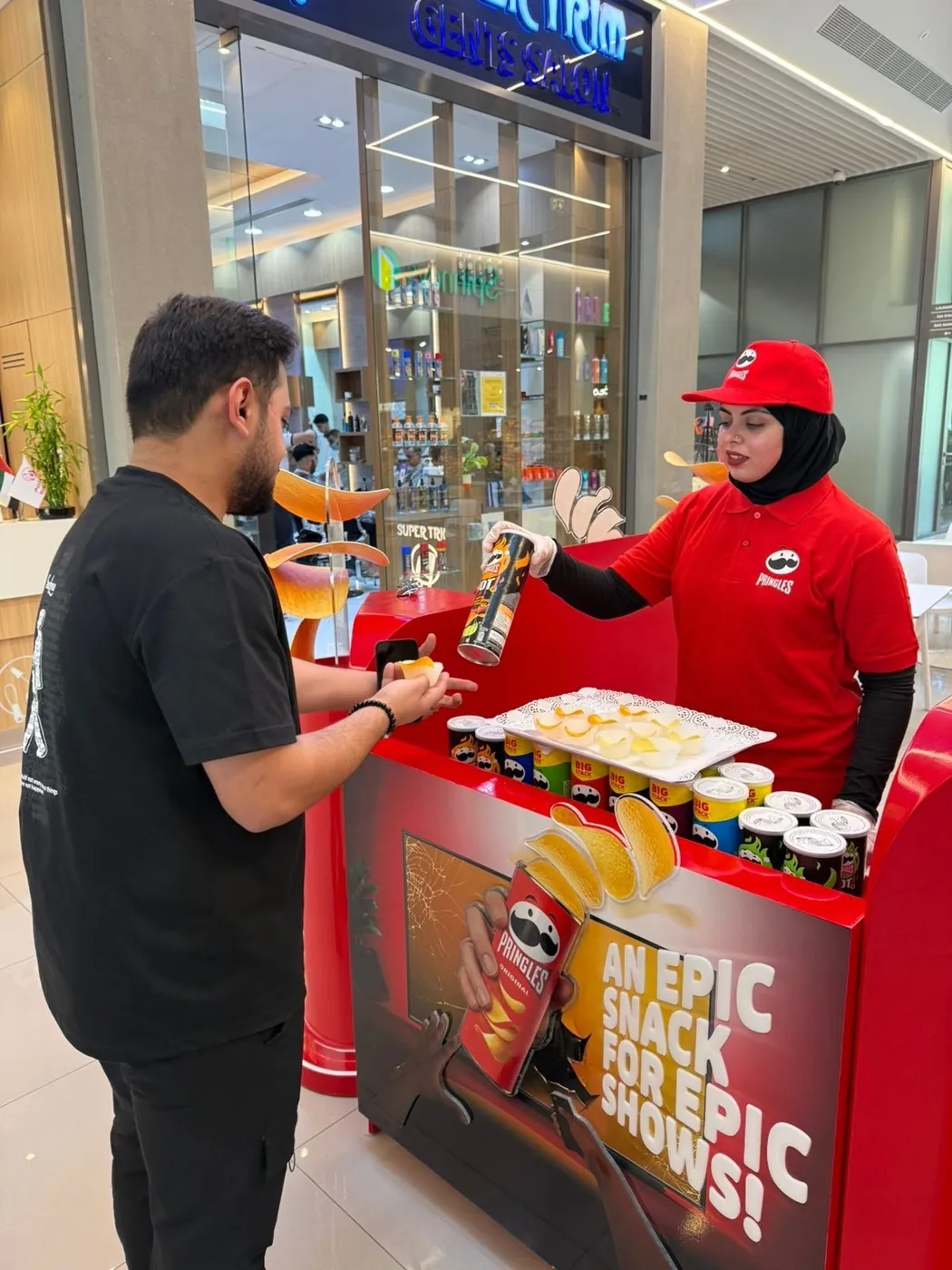 Pringles promoter at a branded stand with the mascot (2)