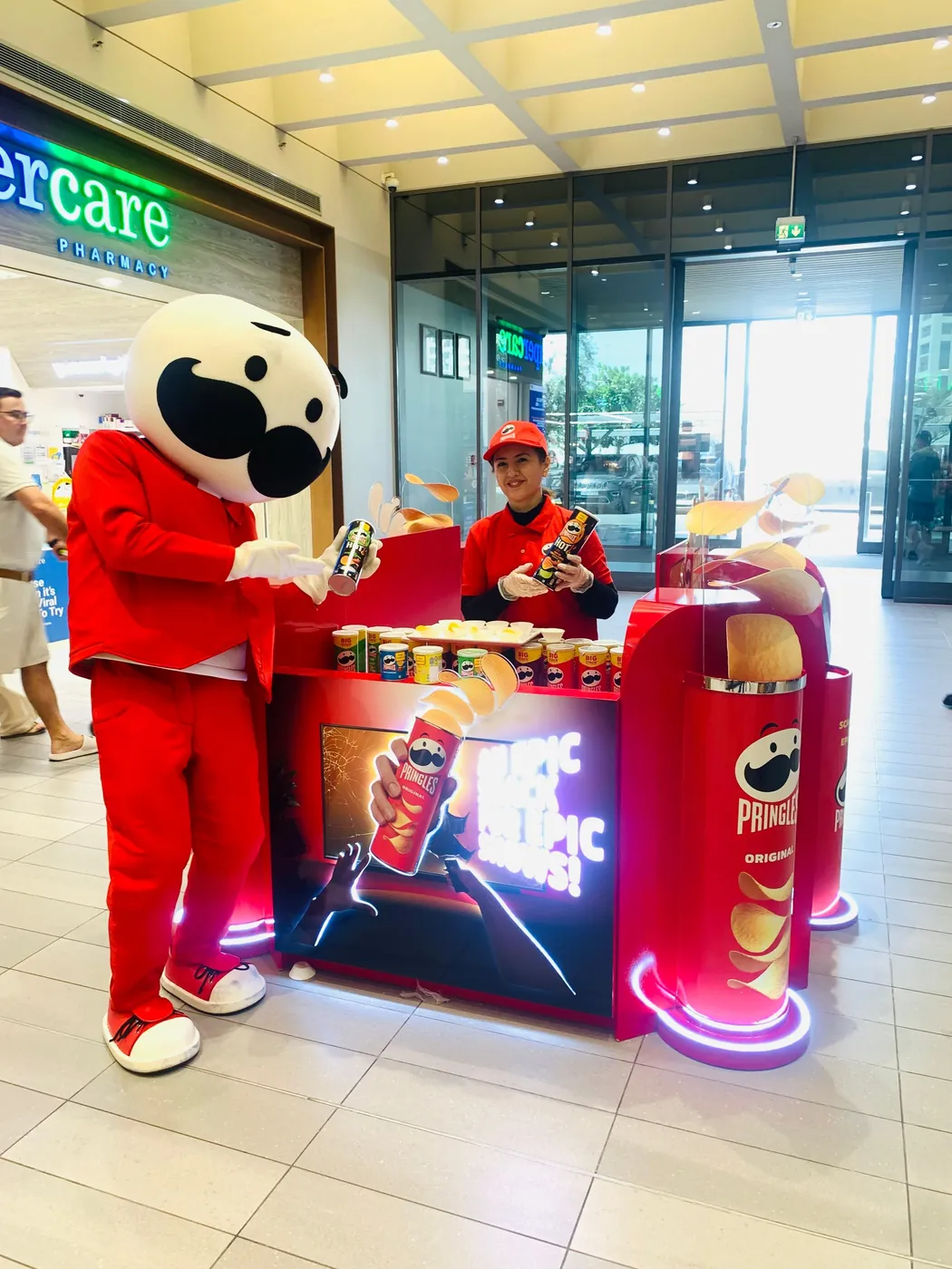 Pringles promoter at a branded stand with the mascot (3)