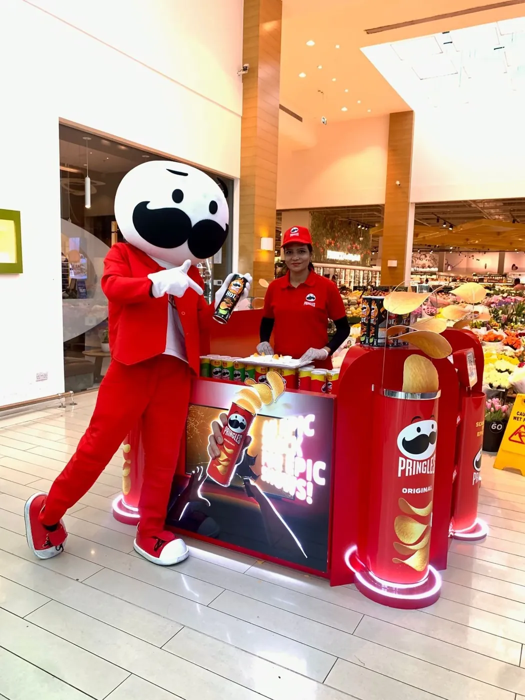 Pringles promoter at a branded stand with the mascot (4)