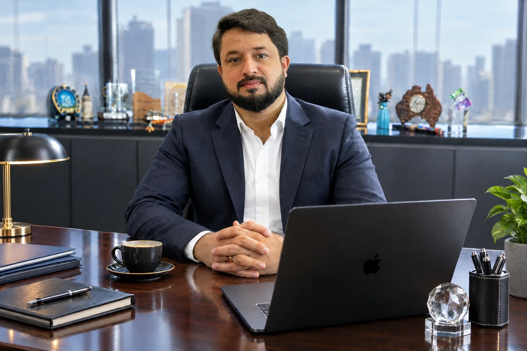 Habib Ur Rehman, Managing Director of Arsh Marketing, seated at his desk in a Dubai office with the city skyline behind him